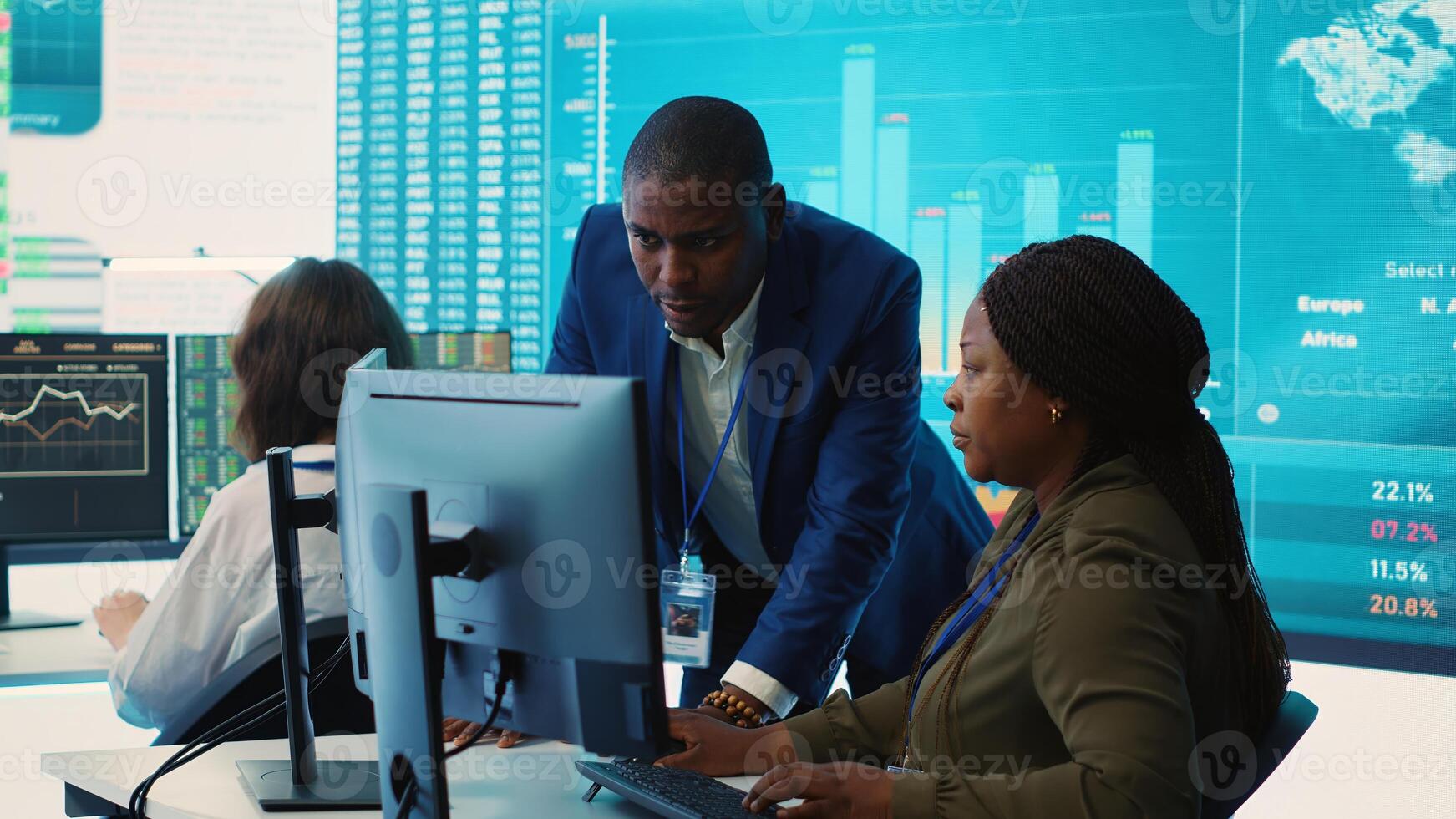 Financial analyst works on resource allocation plans with his staff, analyzing reports and sales infographics to find revenue. Achieve objectives in a competitive business environment. Camera A. photo