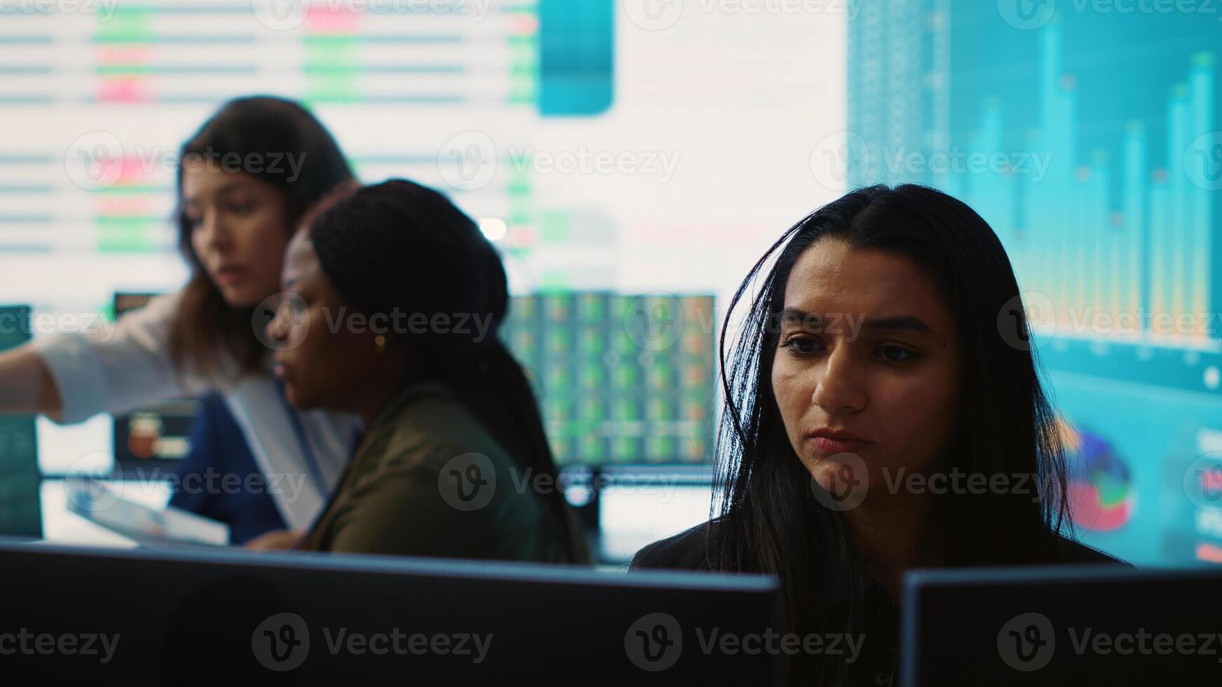 Company employees exchanging project details and big data to help in achieving business objectives, establishing budget and resources. Management team sharing information. Camera A. photo