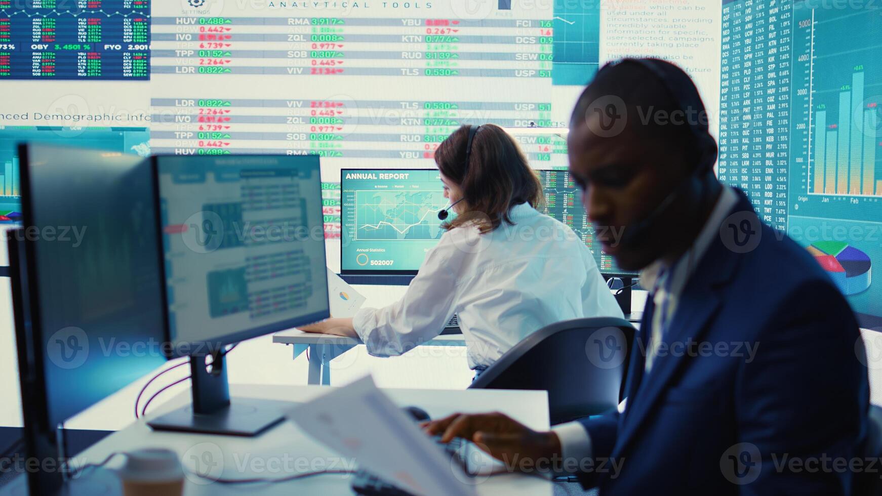 General director examining statistics big data on computer in a control room, makes a briefing report. Business manager studying sales numbers to adapt within market conditions. Camera B. photo