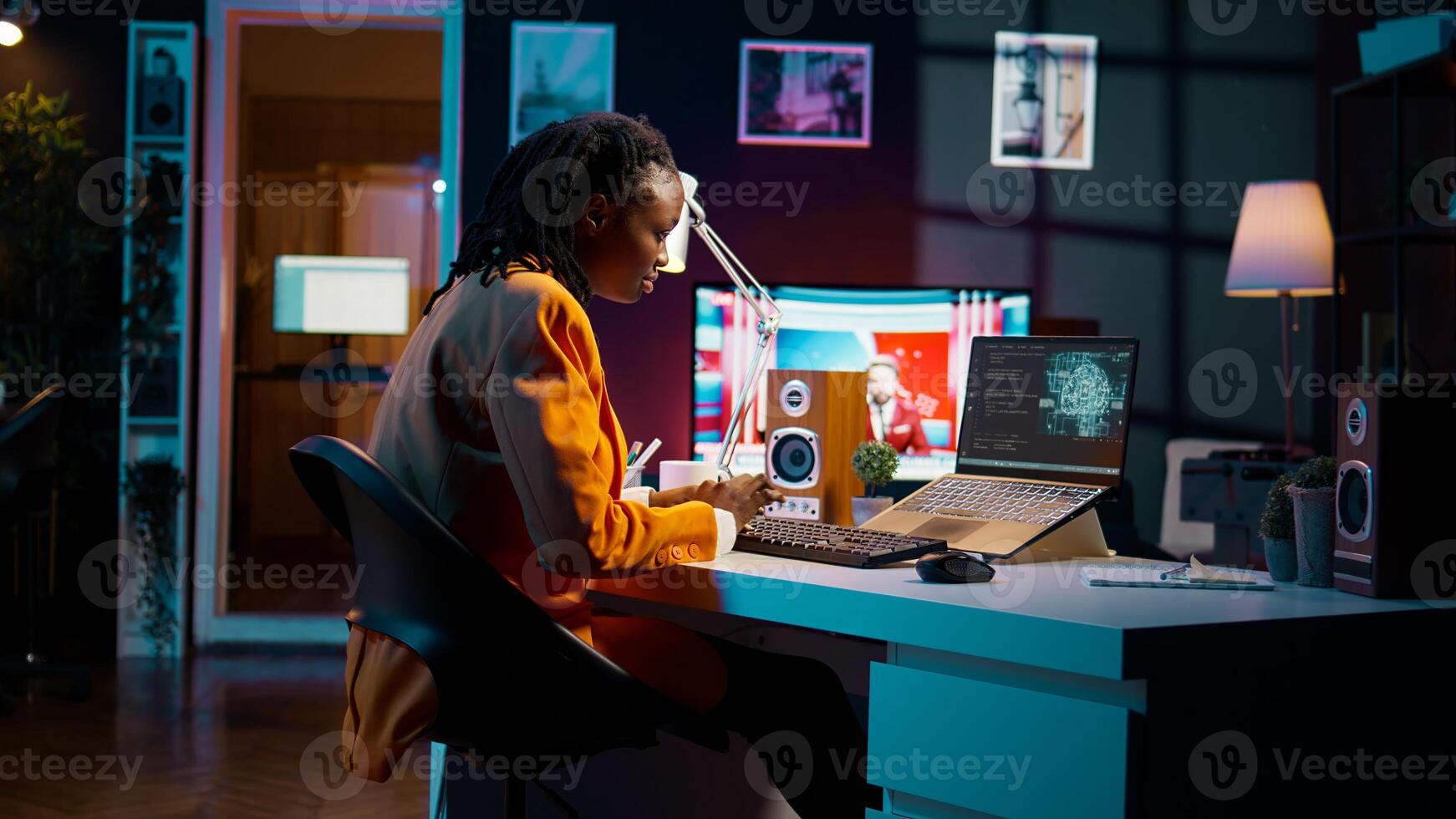 African american girl uses artificial intelligence software for machine learning and cloud computing, terminal window programming language. IT student studying deep learning AI hardware. Camera B. photo