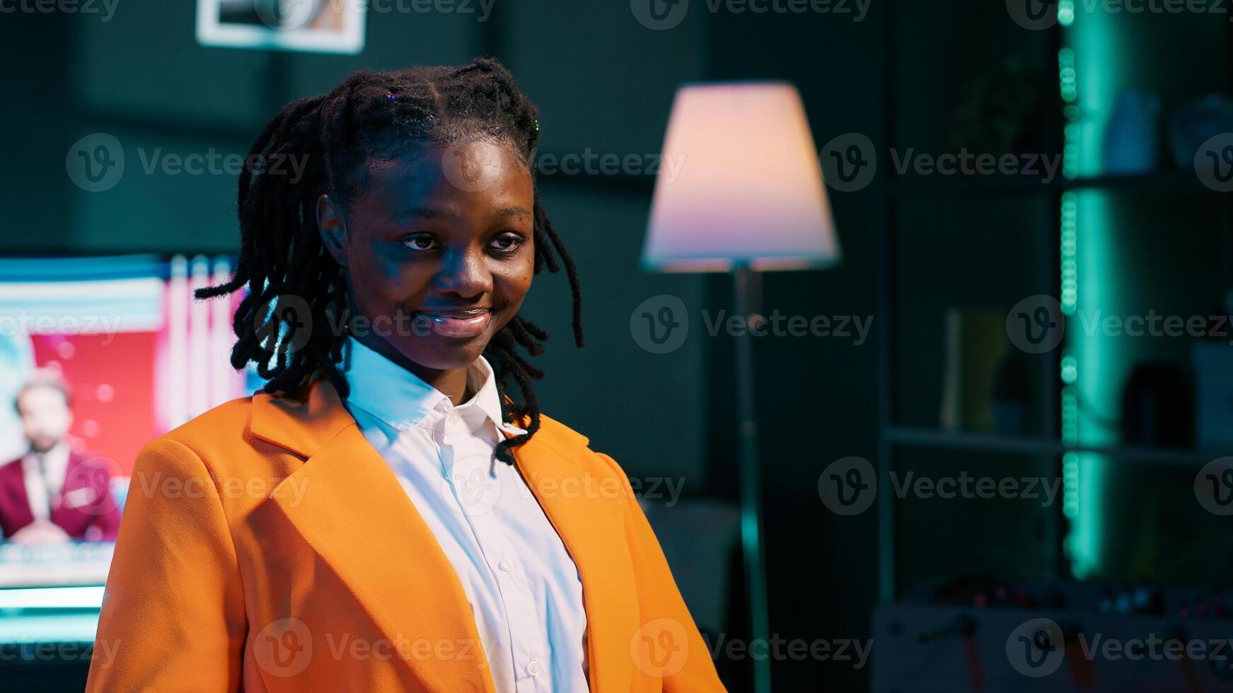 Portrait of university student participating in e learning courses, reviewing lesson materials and lecture notes at home office. Dedicated girl writing ideas for future exams or tests. Camera A. photo