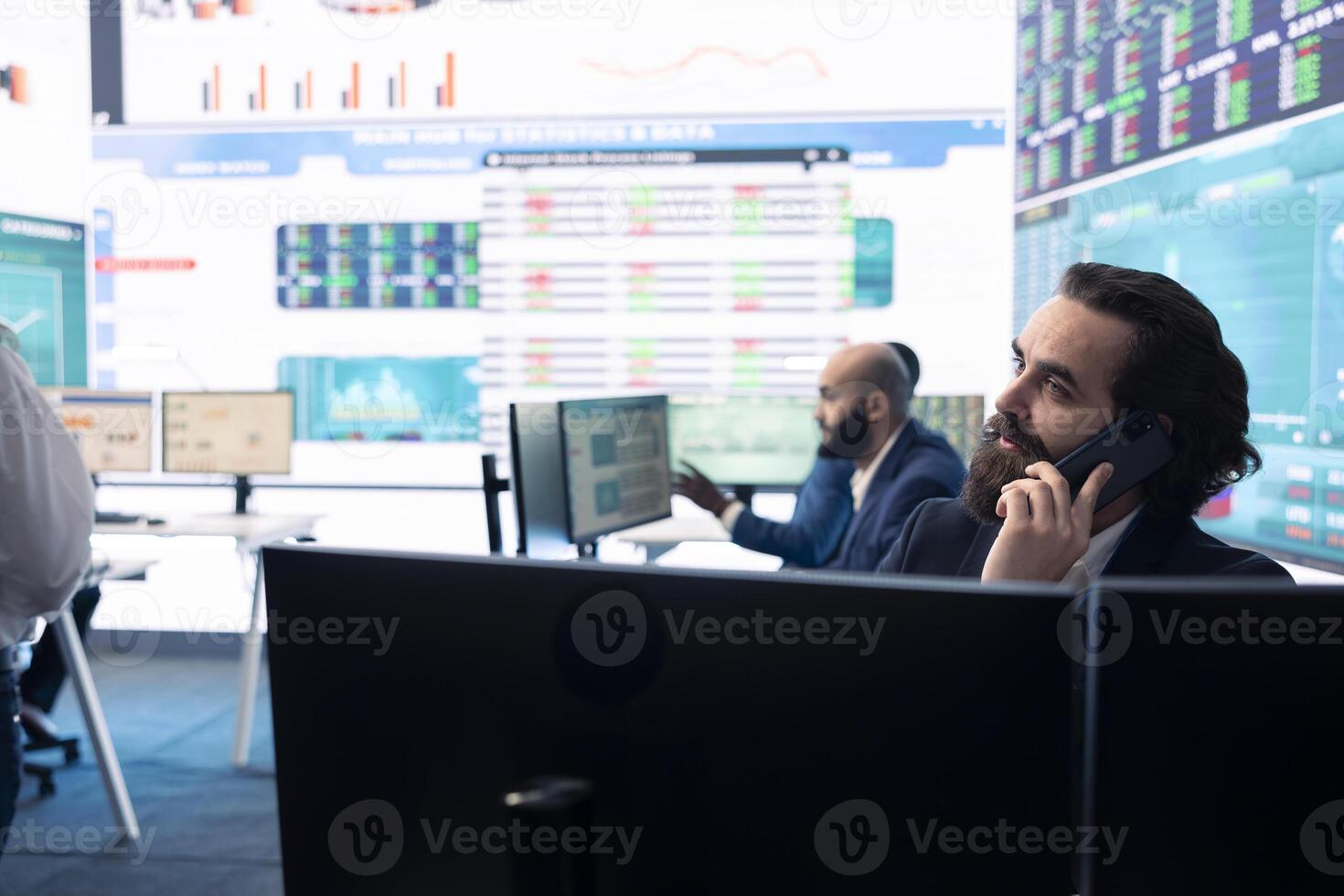 Management associate sharing insight on annual statistics during a call with the advisory board, providing initiatives to enhance operational performance metrics. Big data on a screen. photo