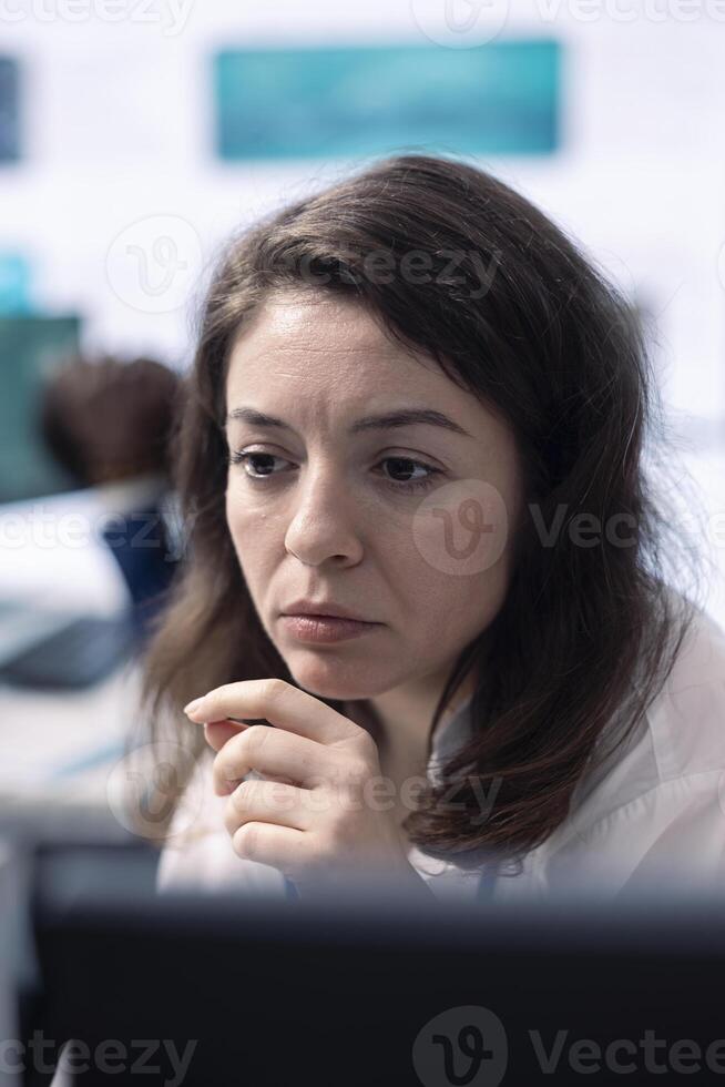 Company employee establishing project details and essential information about achieving business objectives, allocating budget and other resources. Strategic projection on pc. photo