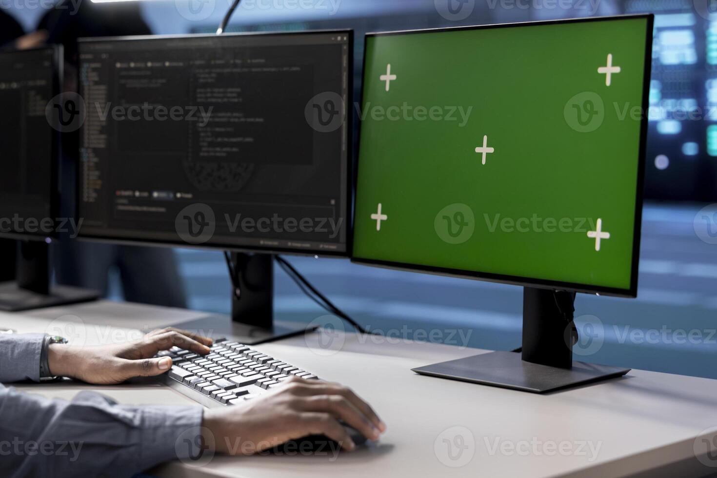 Engineer in server hub using green screen PC to repair equipment storing datasets. Professional using mockup computer to do debugging on rigs doing computational operations photo