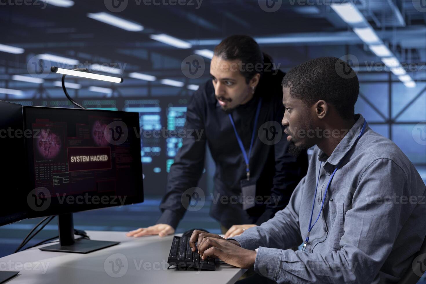 Team of developers in server hub trying to protect hardware from hacker stealing information. Coworkers in data center workplace trying to fix security breach alert caused by virus photo