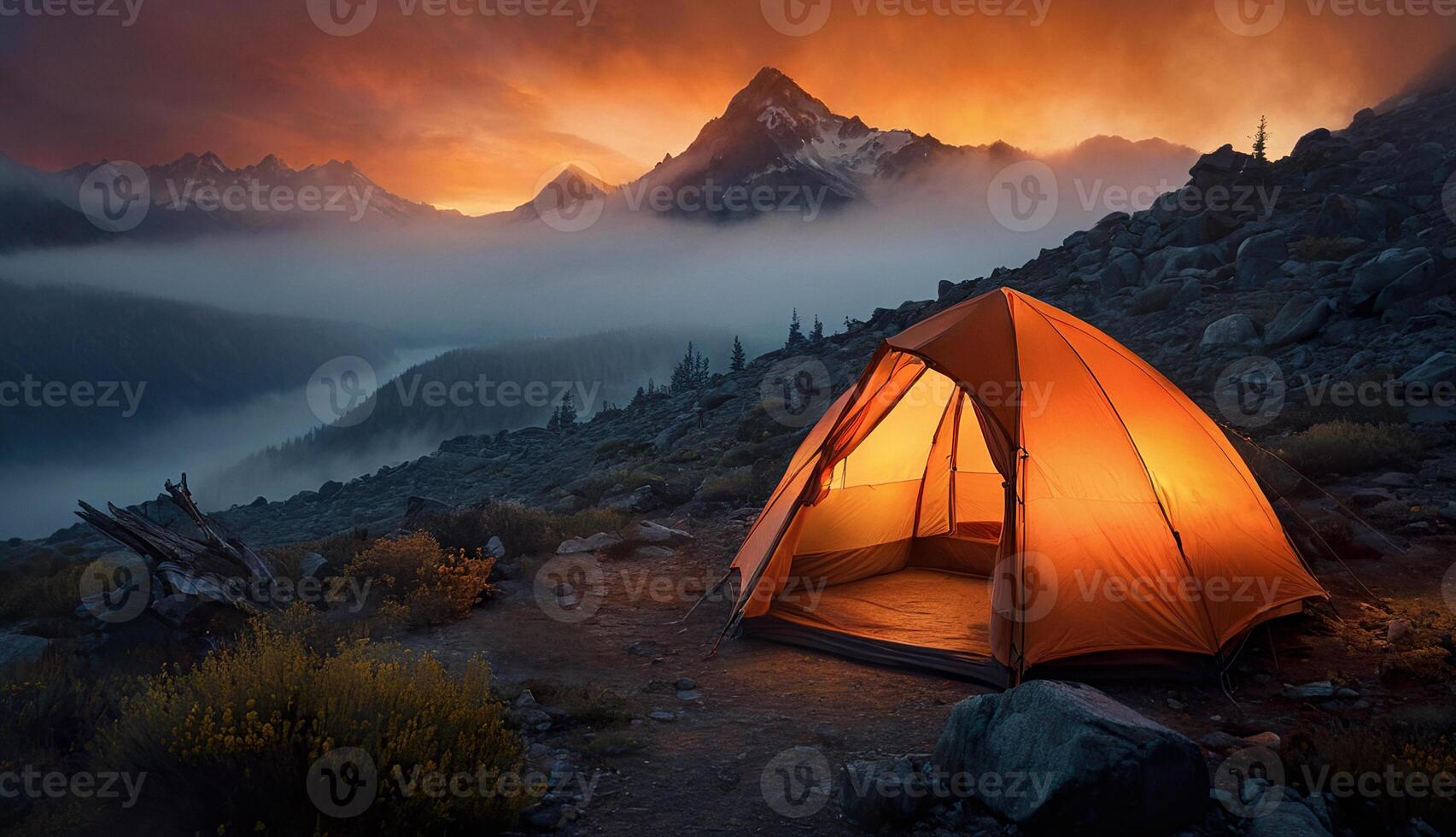 glowing orange tourist tent on a background of mountains, fog and forest, tourism, travel photo