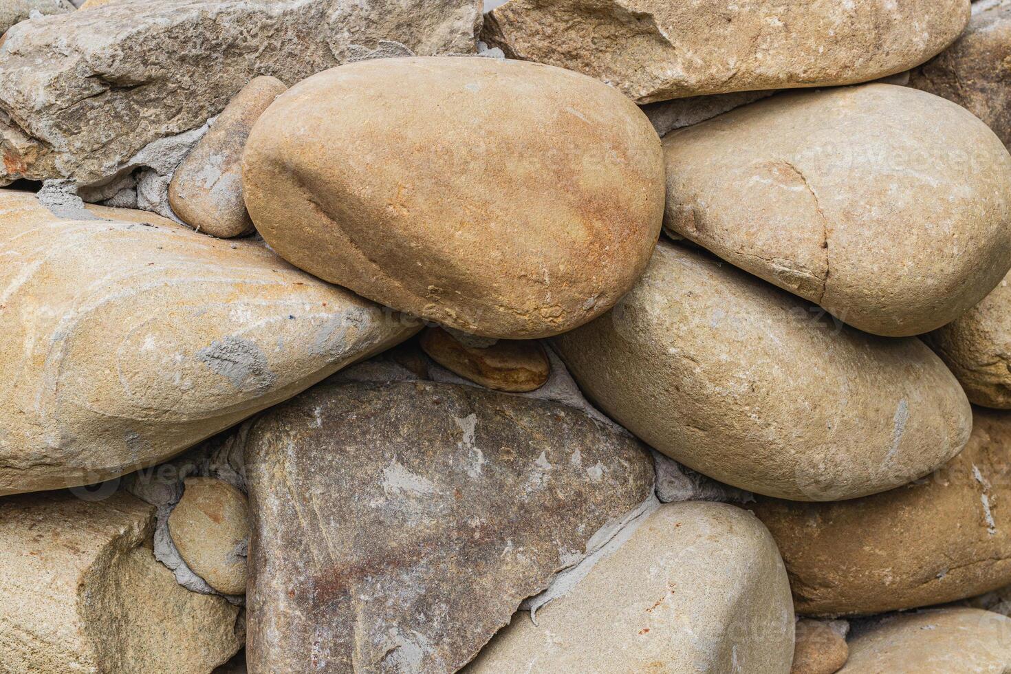 Top view of round river pebbles stones floor photo