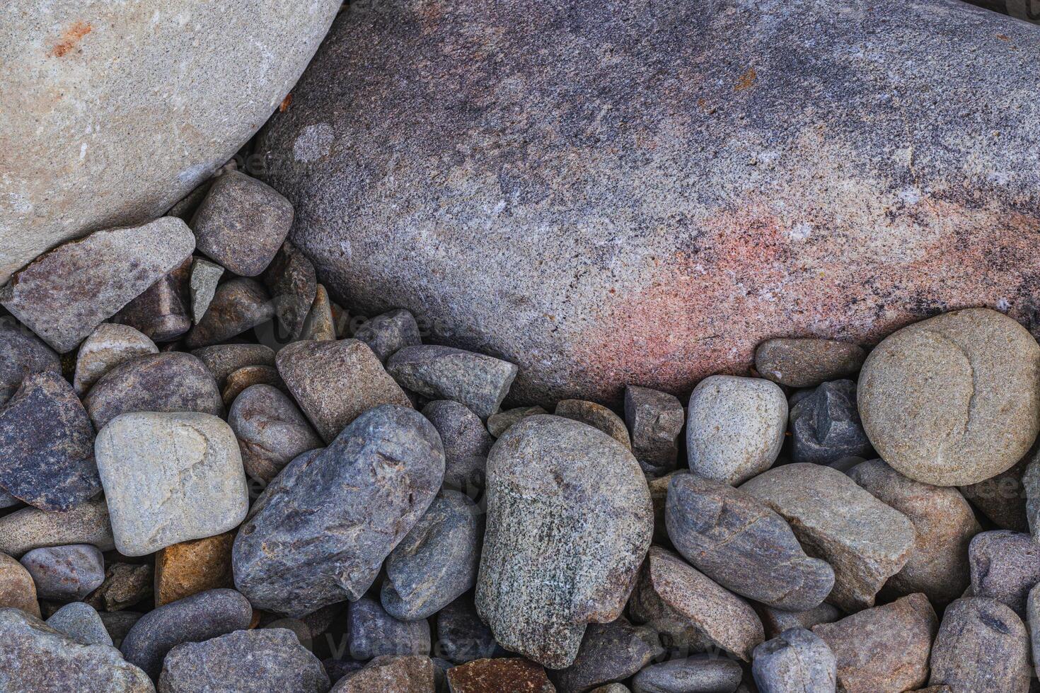 Top view of round river pebbles stones floor photo