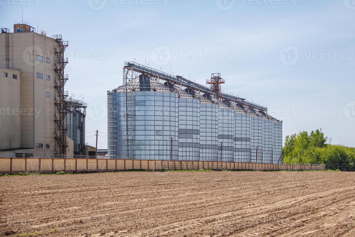 silos granary elevator on agro-industrial complex with seed cleaning and drying line for grain storage photo