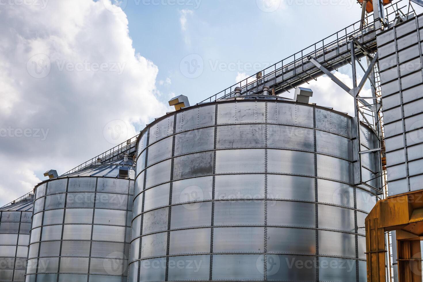 silos granary elevator on agro-industrial complex with seed cleaning and drying line for grain storage photo