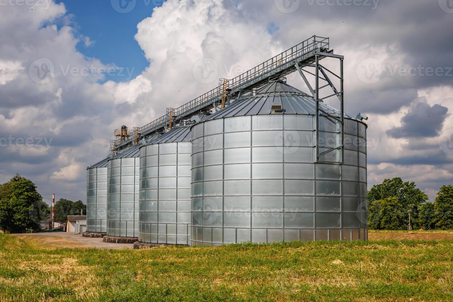 silos granary elevator on agro-industrial complex with seed cleaning and drying line for grain storage photo