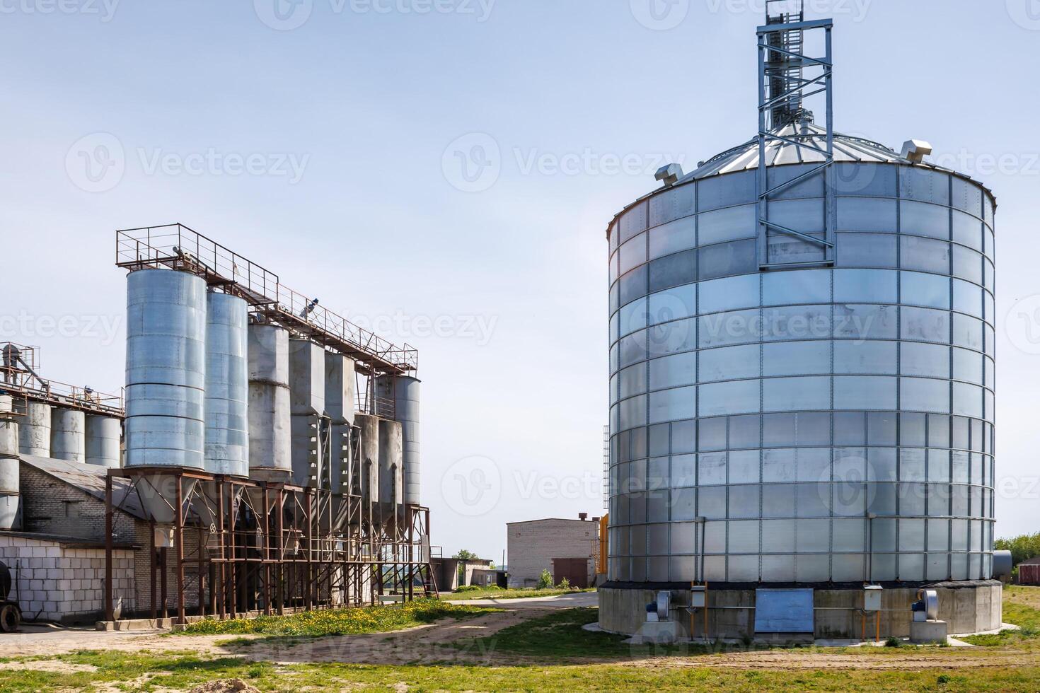 silos granary elevator on agro-industrial complex with seed cleaning and drying line for grain storage photo