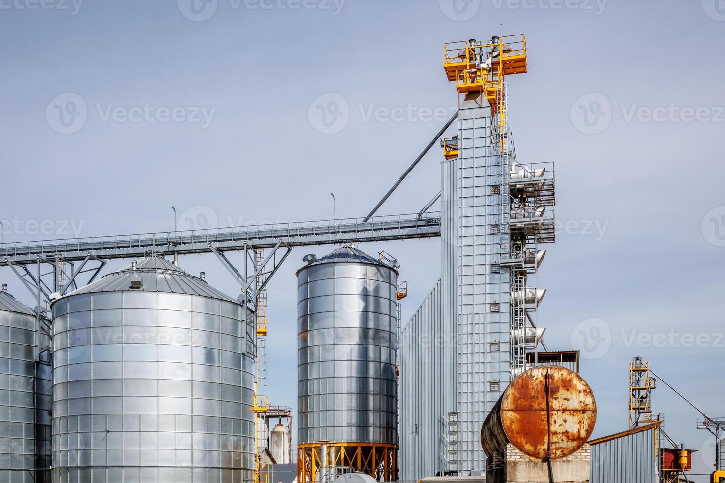 silos granary elevator on agro-industrial complex with seed cleaning and drying line for grain storage photo