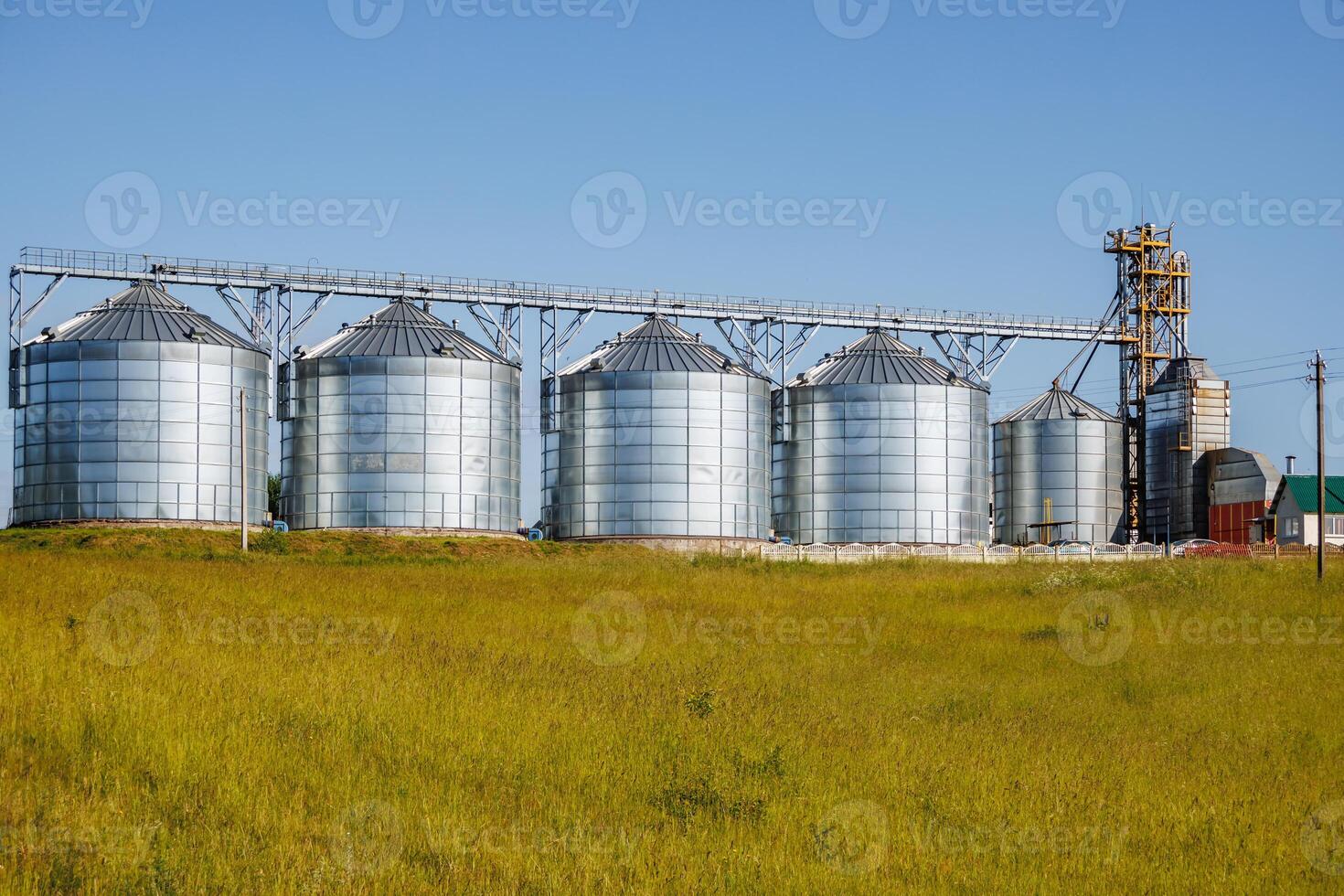 silos granary elevator on agro-industrial complex with seed cleaning and drying line for grain storage photo