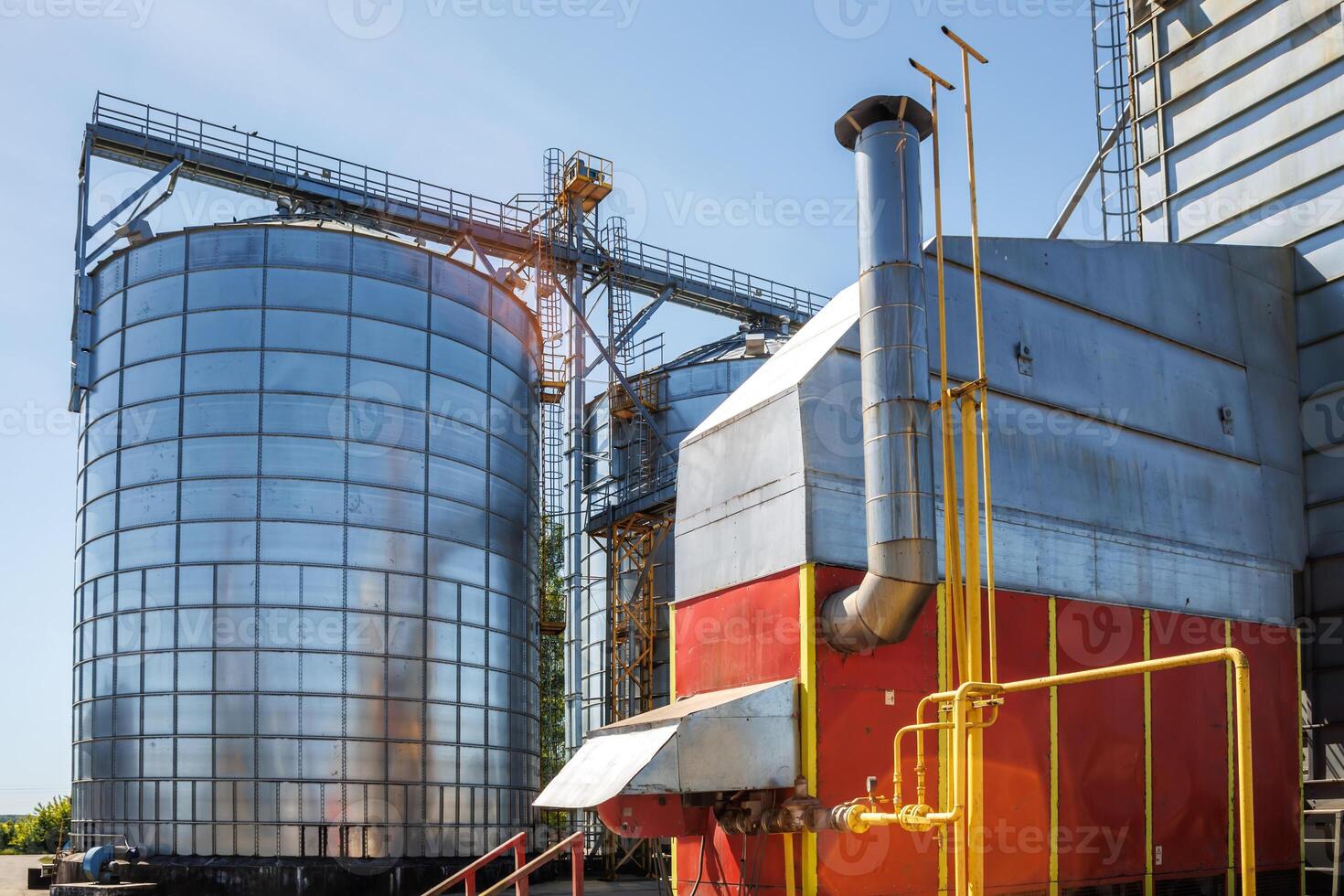 silos granary elevator on agro-industrial complex with seed cleaning and drying line for grain storage photo
