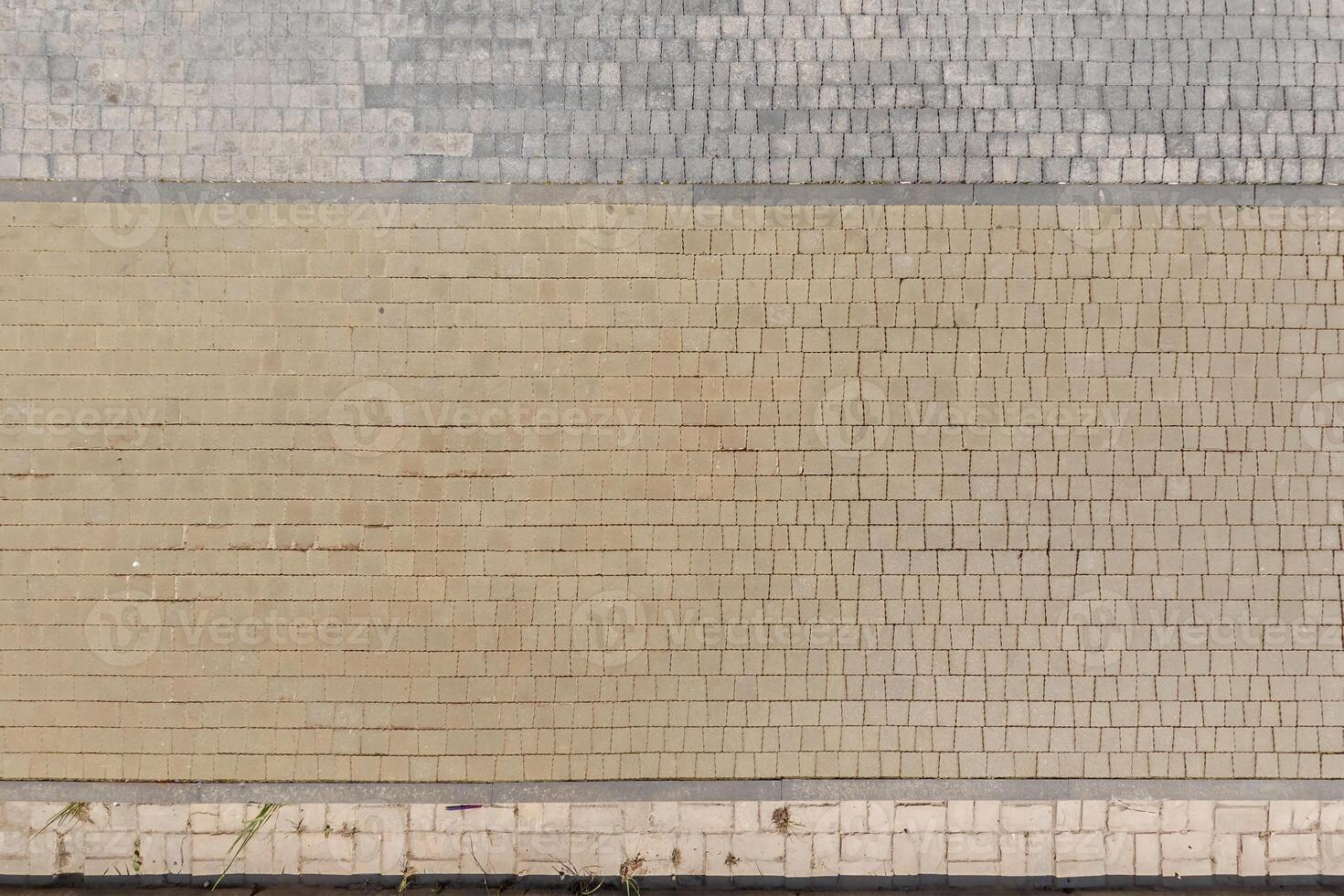 top view of the texture of paving slabs on pedestrian path photo