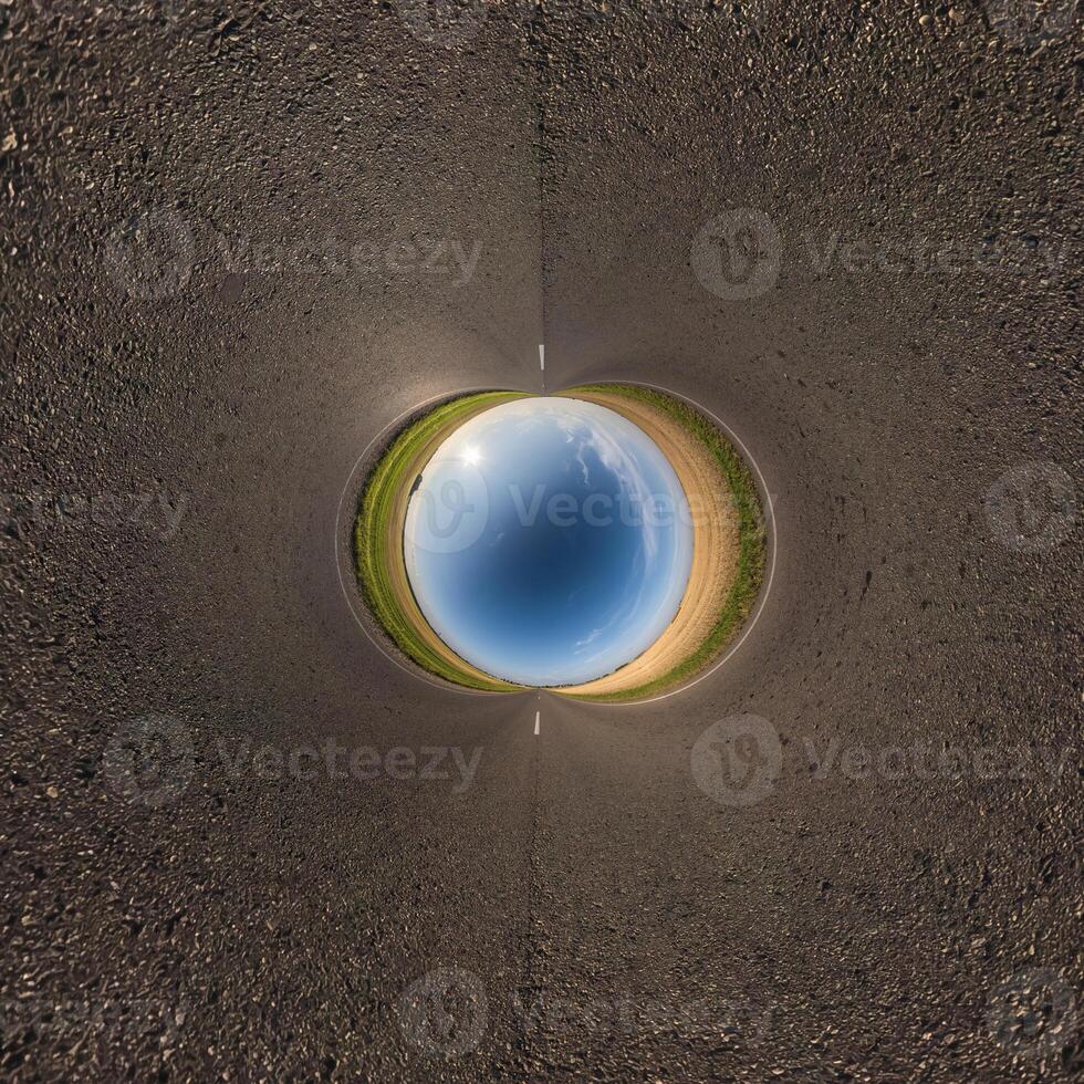 blue hole sphere or globe little planet inside sand or dry grass round frame background photo