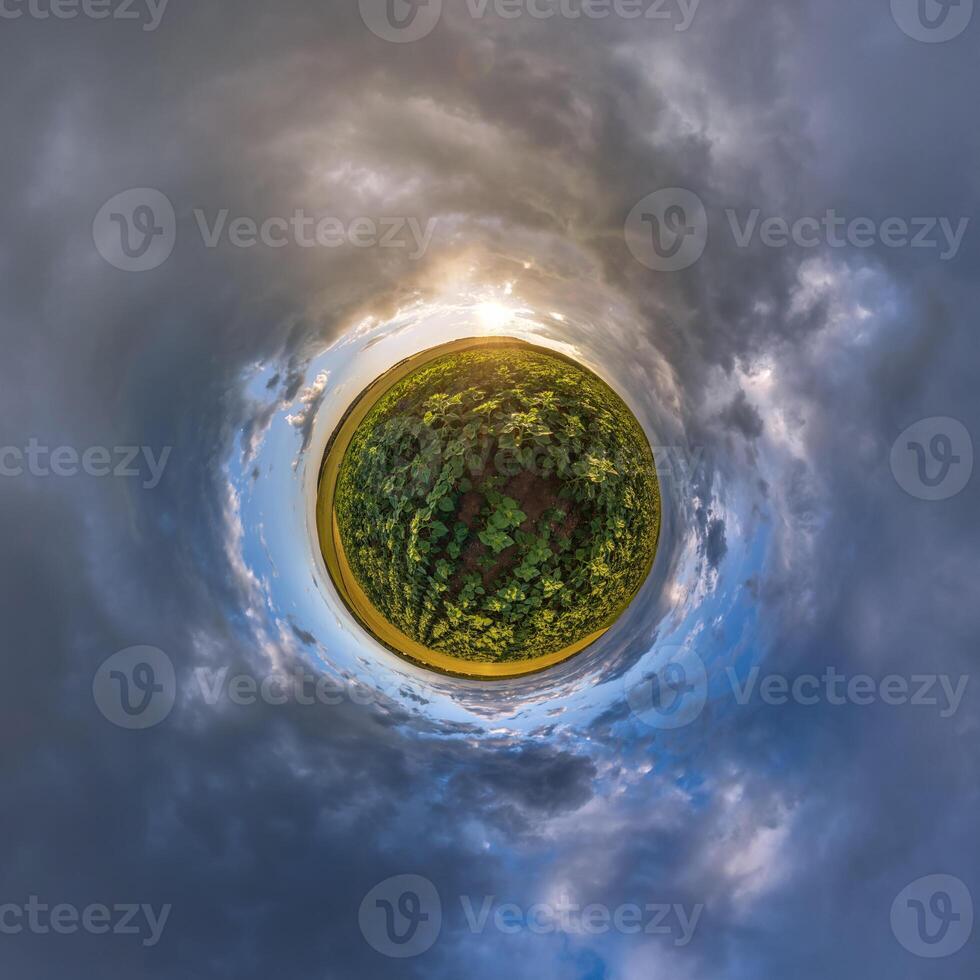 simple tiny planet without buildings in blue sky with beautiful clouds. Transformation of spherical panorama 360 degrees. Spherical abstract aerial view. Curvature of space. photo