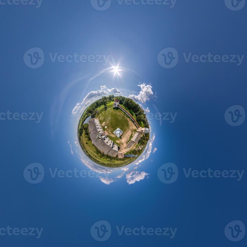 simple tiny planet without buildings in blue sky with beautiful clouds. Transformation of spherical panorama 360 degrees. Spherical abstract aerial view. Curvature of space. photo