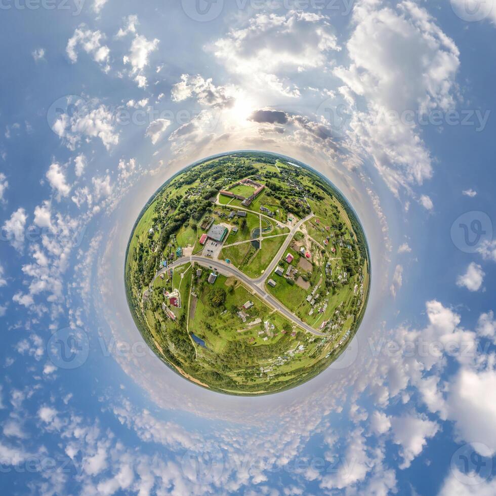 simple tiny planet without buildings in blue sky with beautiful clouds. Transformation of spherical panorama 360 degrees. Spherical abstract aerial view. Curvature of space. photo