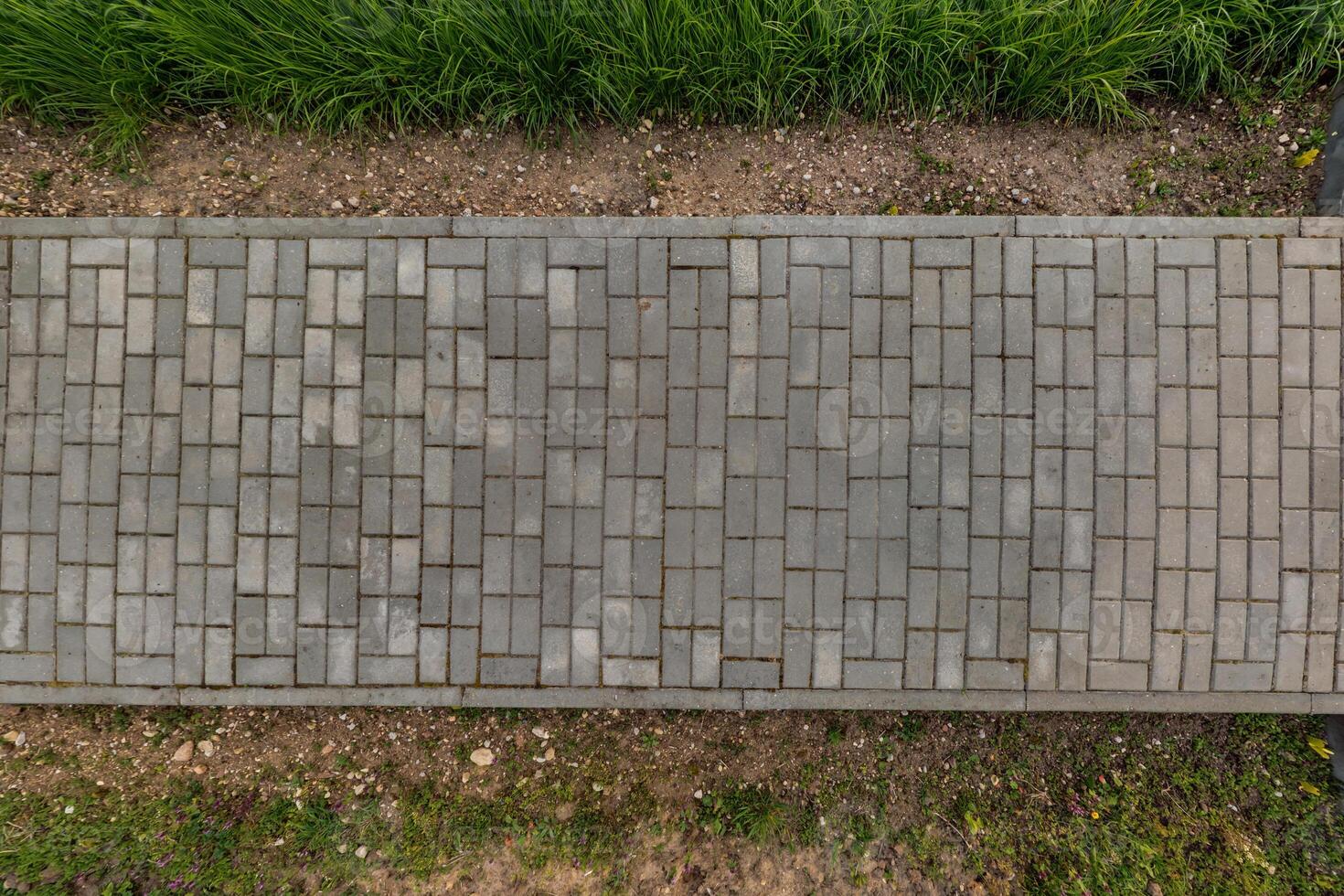 top view of the texture of paving slabs on pedestrian path photo