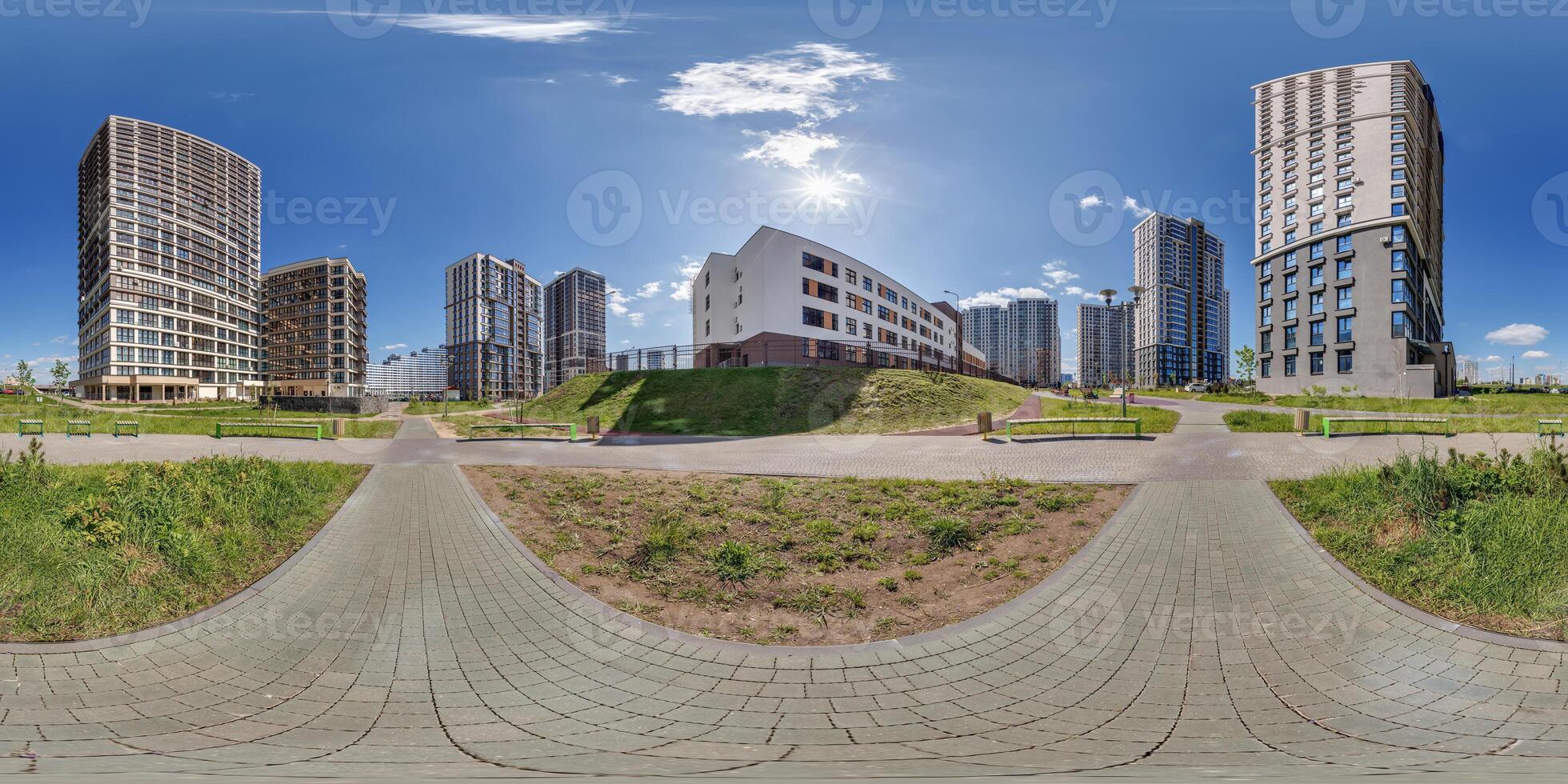 hdri 360 panorama near skyscraper multistory buildings of modern residential quarter complex in full equirectangular seamless spherical projection photo