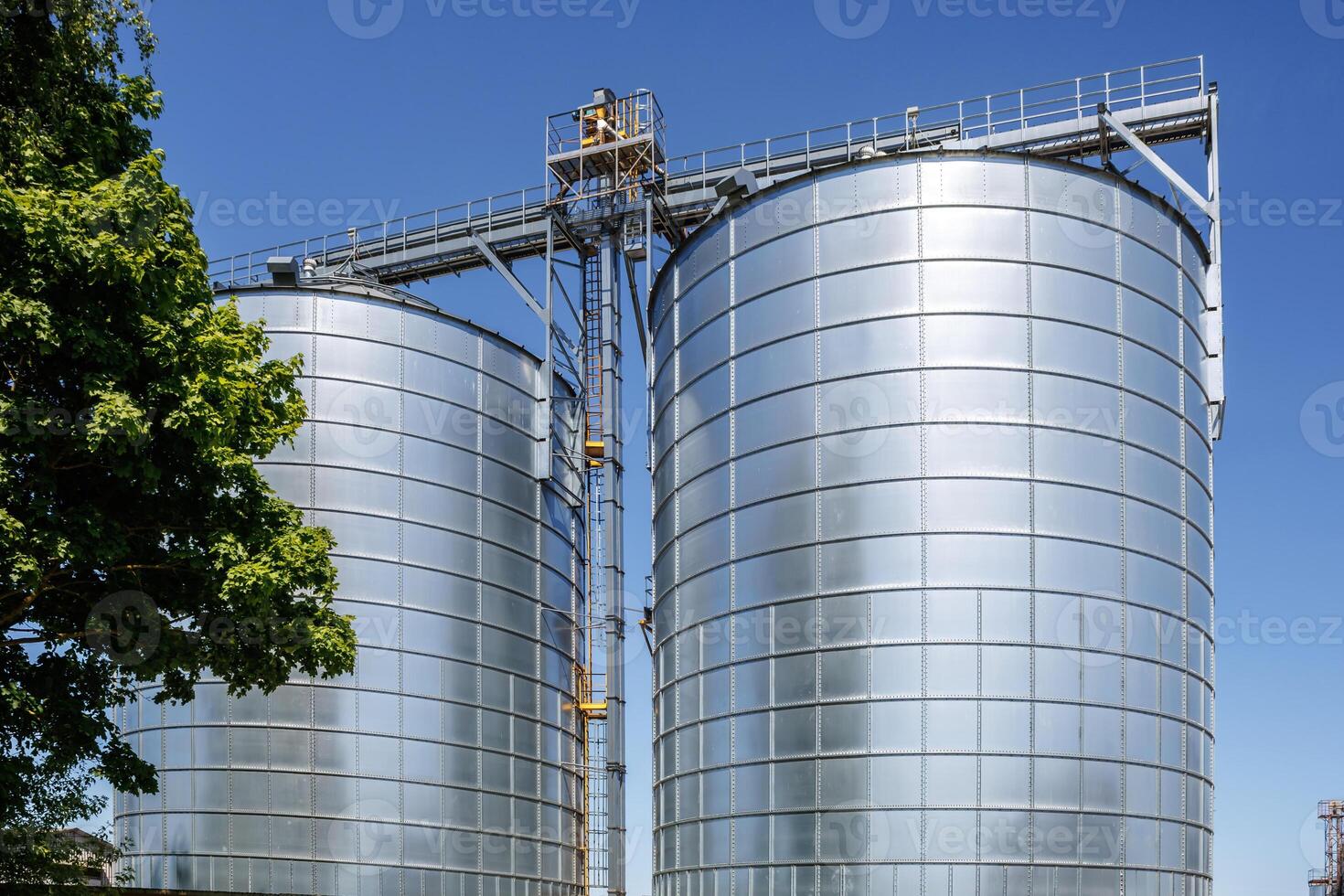 silos granary elevator on agro-industrial complex with seed cleaning and drying line for grain storage photo