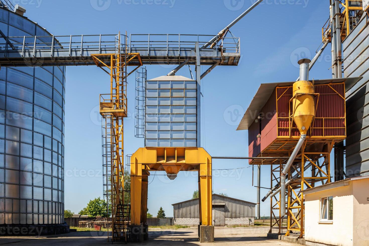 silos granary elevator on agro-industrial complex with seed cleaning and drying line for grain storage photo