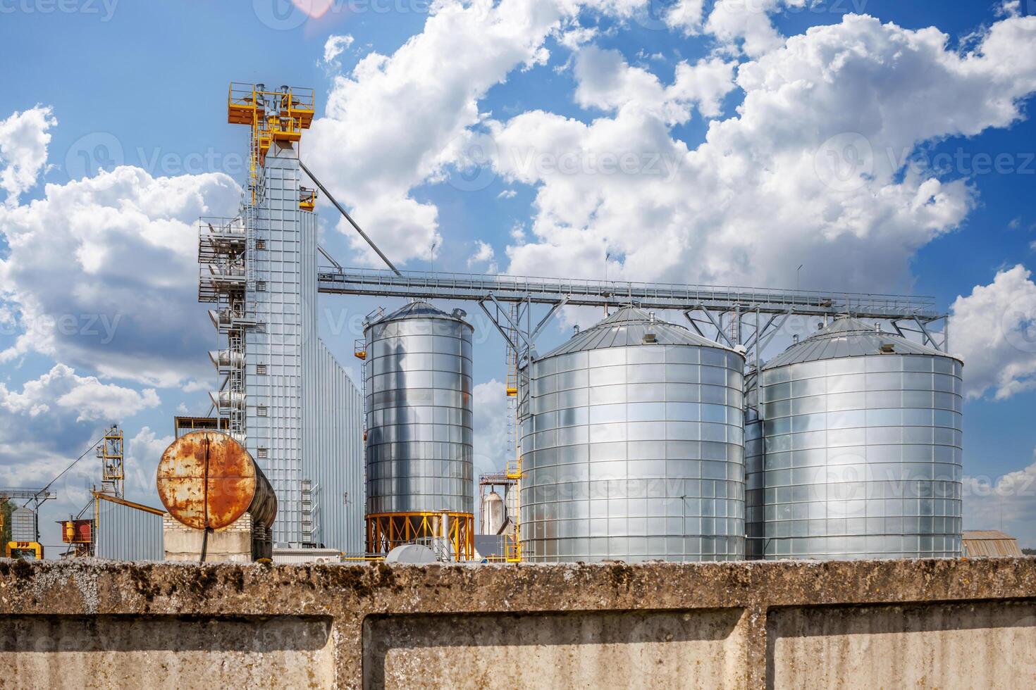 silos granary elevator on agro-industrial complex with seed cleaning and drying line for grain storage photo