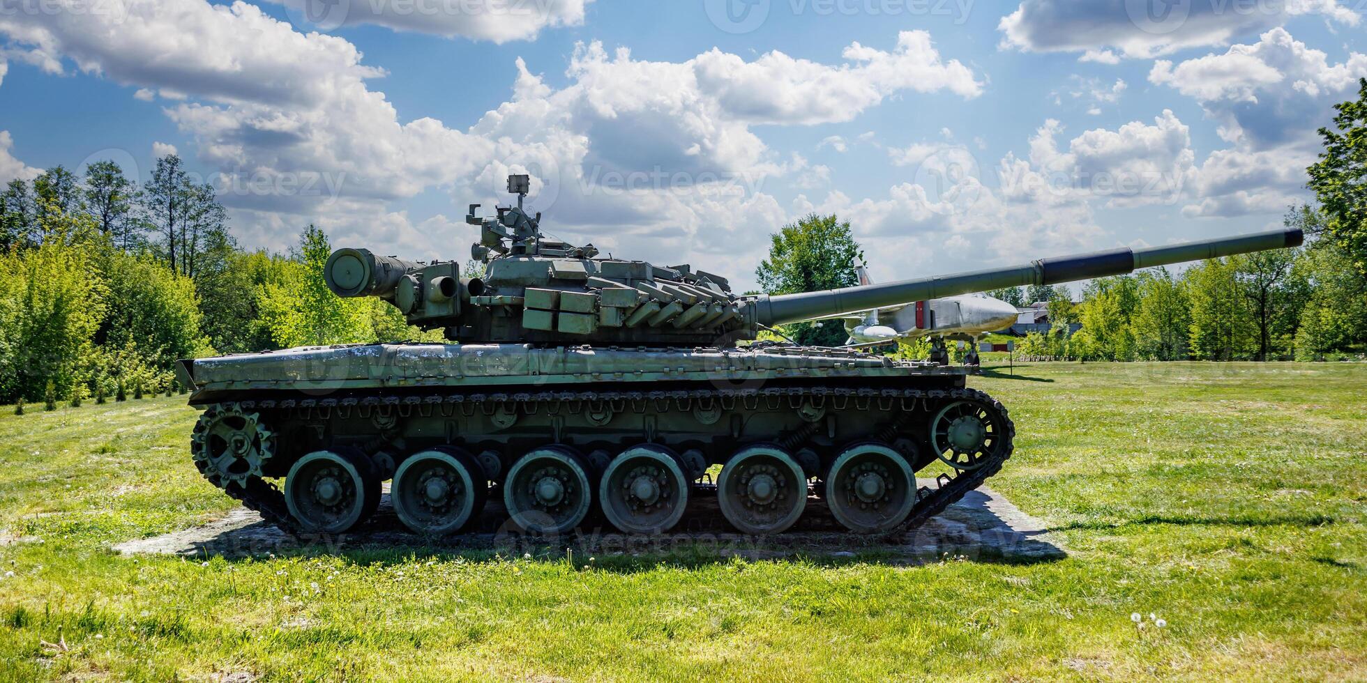 tank t80, armored vehicles with dynamic protection unit on street in green khaki color photo