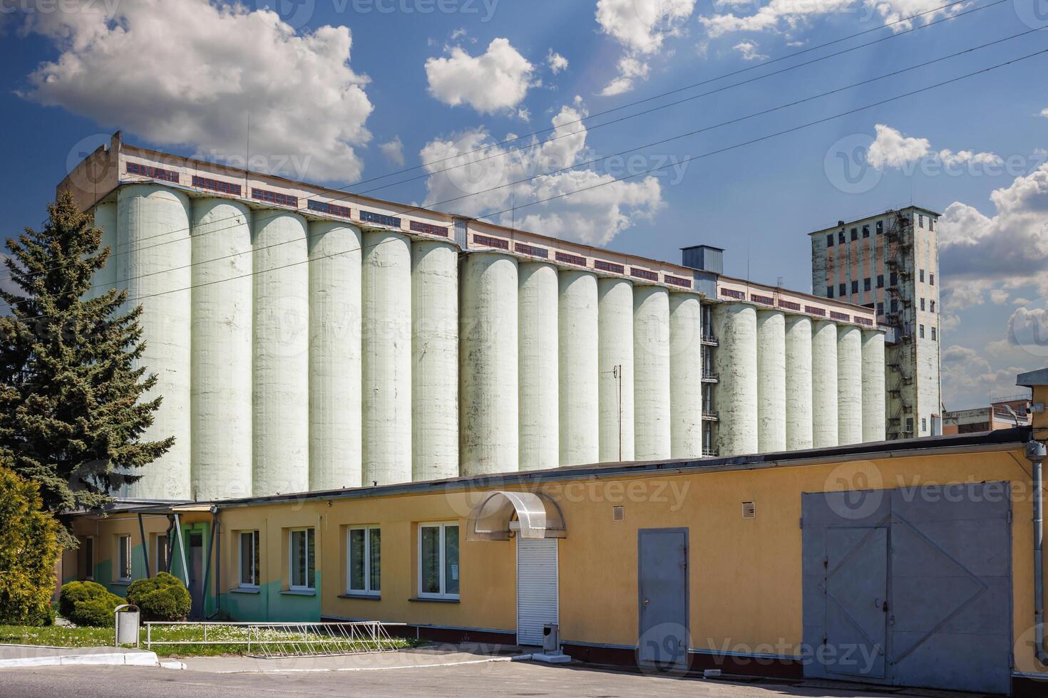 silos granary elevator on agro-industrial complex with seed cleaning and drying line for grain storage photo