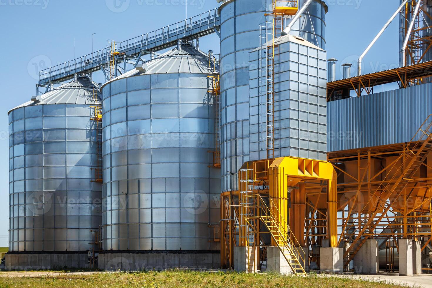silos granary elevator on agro-industrial complex with seed cleaning and drying line for grain storage photo