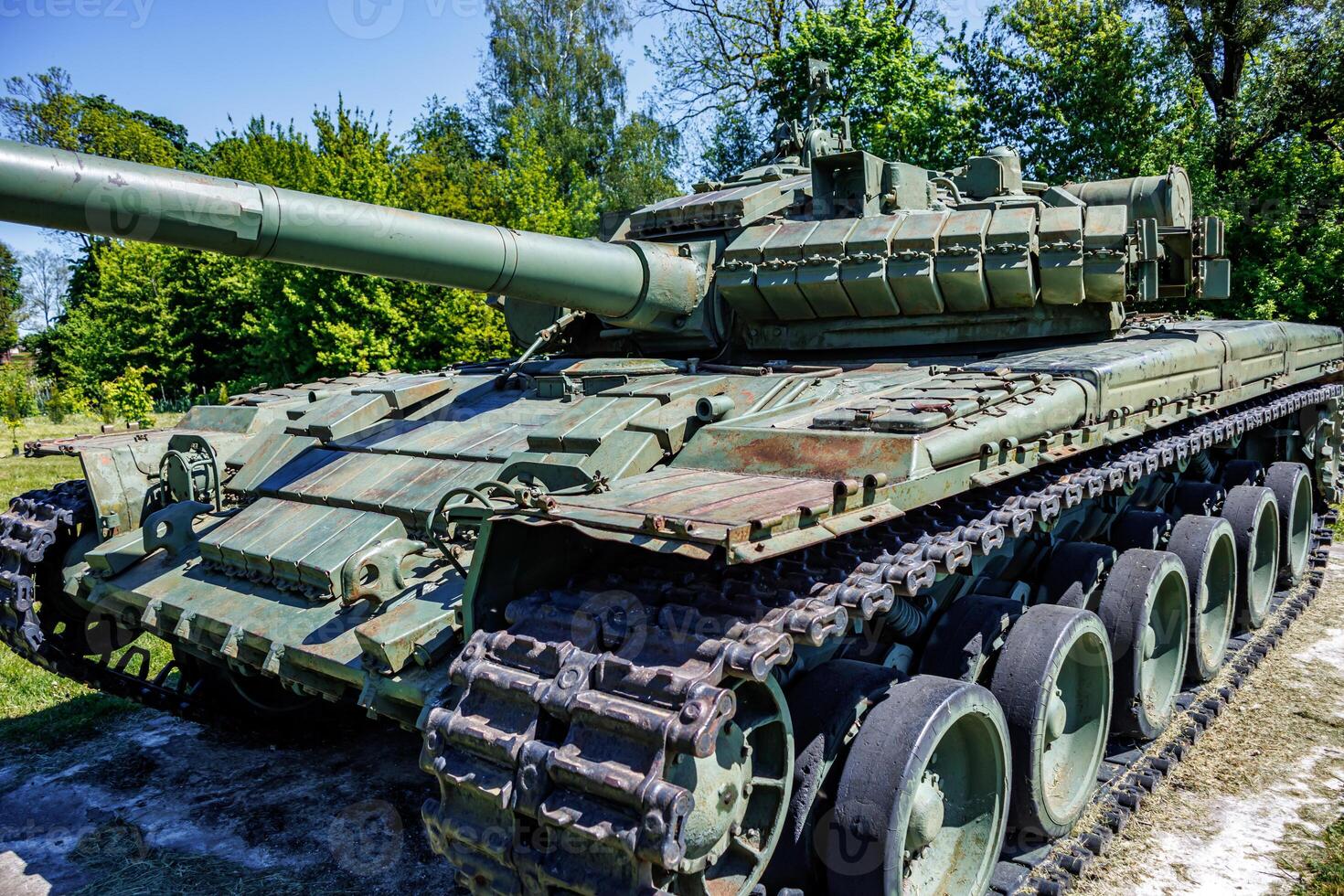 tank t80, armored vehicles with dynamic protection unit on street in green khaki color photo