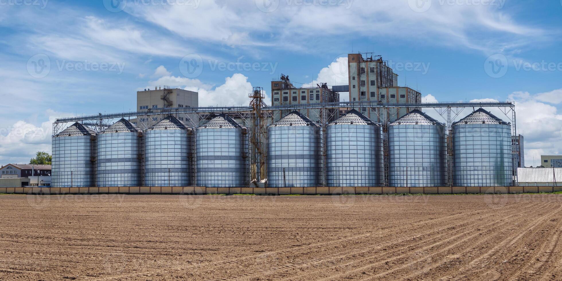 silos granary elevator on agro-industrial complex with seed cleaning and drying line for grain storage photo