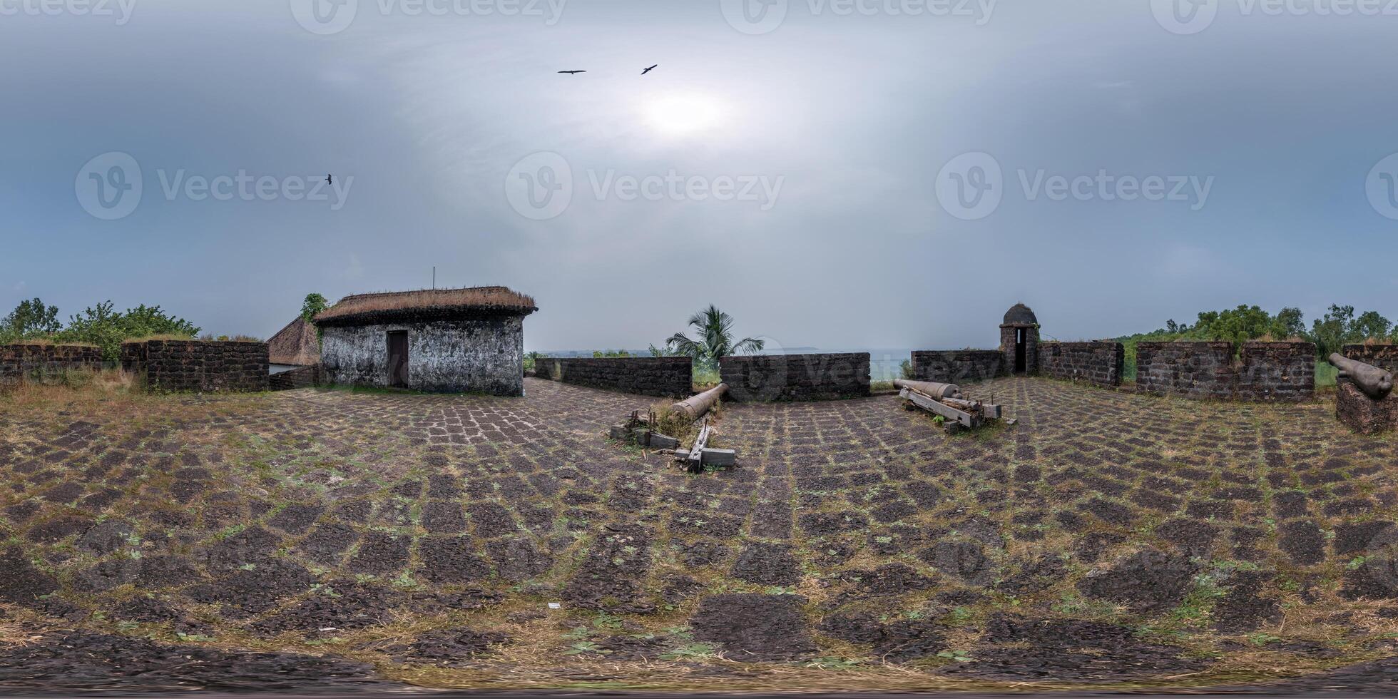 full hdri 360 panorama portuguese defensive abandoned military fortress with old guns on ocean in equirectangular spherical projection with zenith and nadir. VR AR content photo