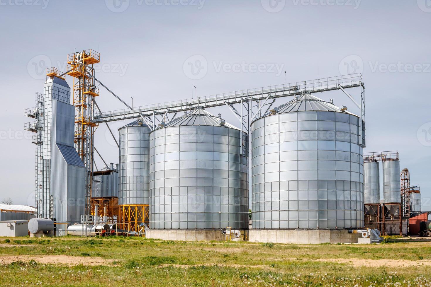 silos granary elevator on agro-industrial complex with seed cleaning and drying line for grain storage photo
