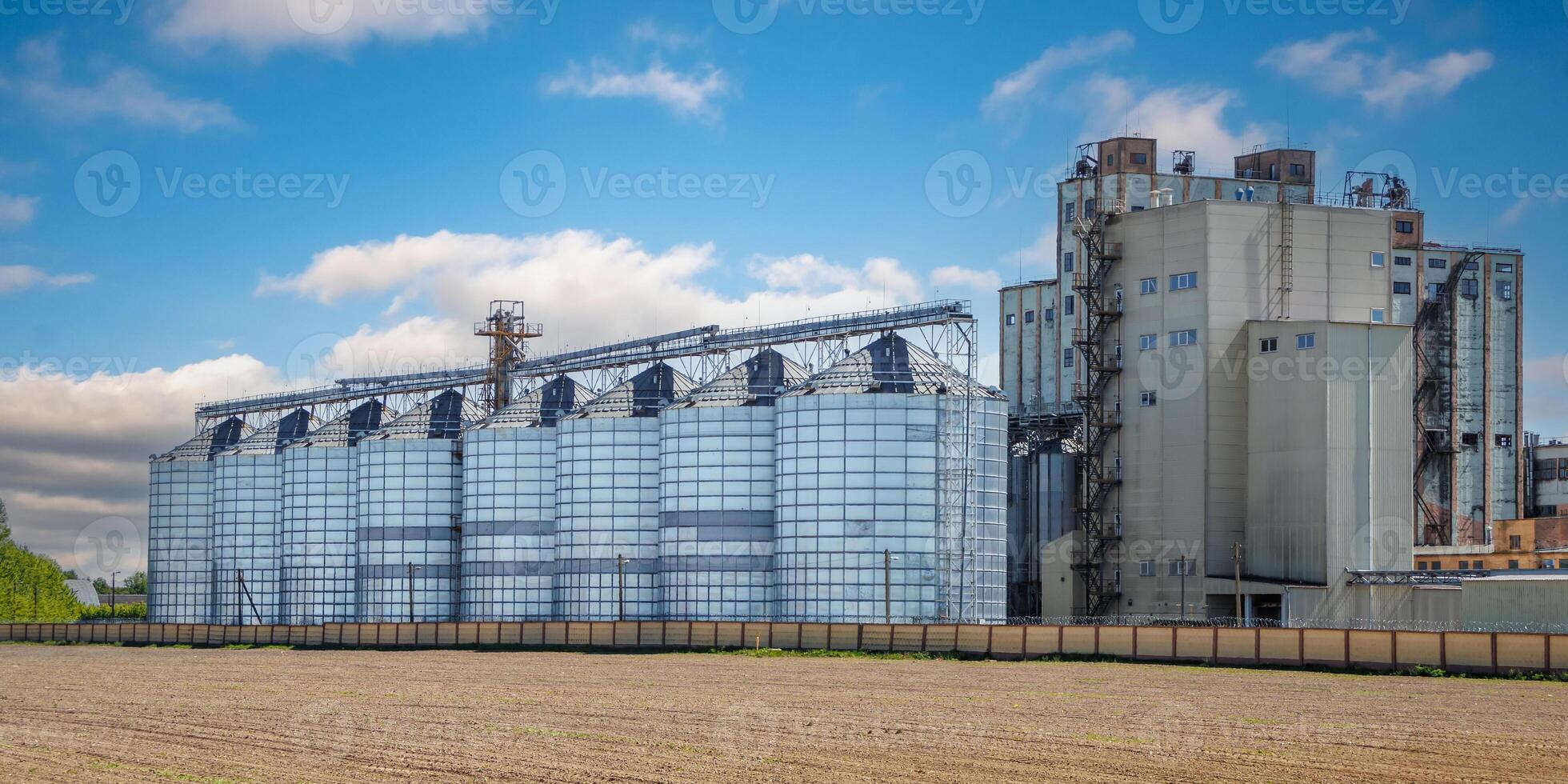 silos granary elevator on agro-industrial complex with seed cleaning and drying line for grain storage photo