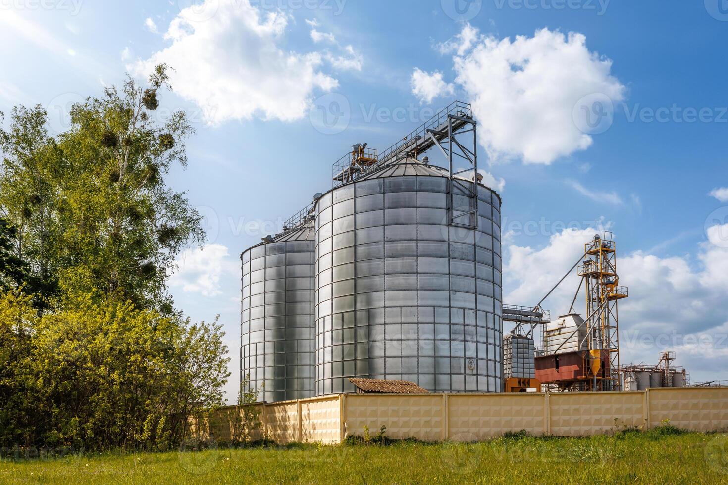 silos granary elevator on agro-industrial complex with seed cleaning and drying line for grain storage photo