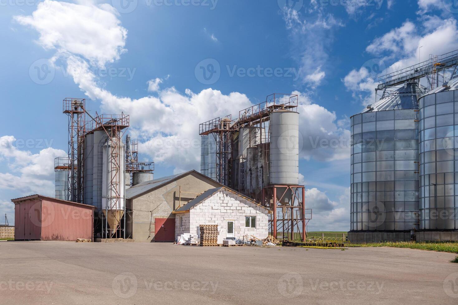silos granary elevator on agro-industrial complex with seed cleaning and drying line for grain storage photo