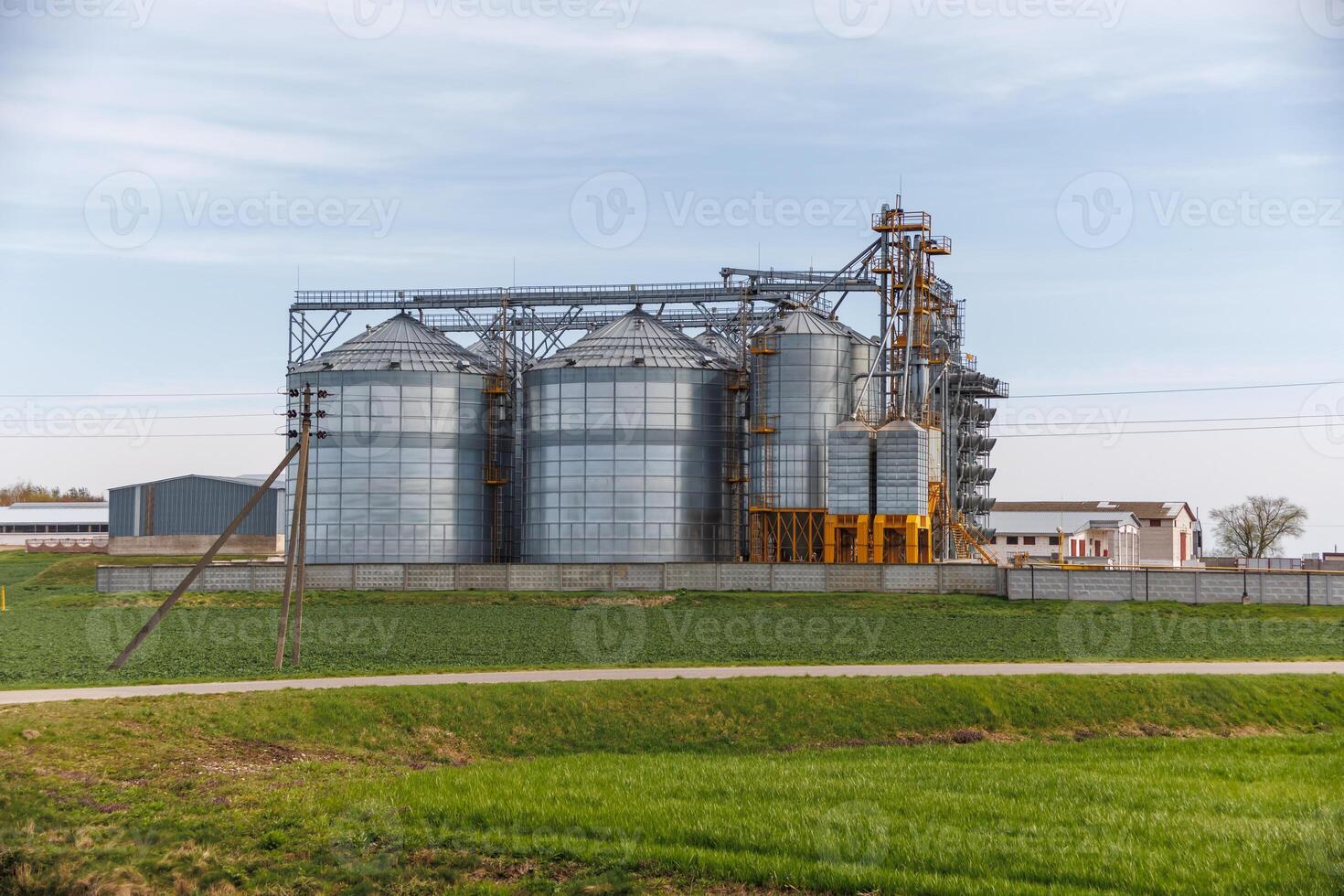 silos granary elevator on agro-industrial complex with seed cleaning and drying line for grain storage photo