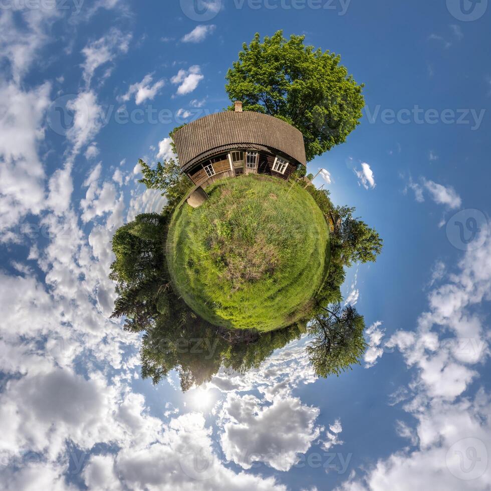simple tiny planet without buildings in blue sky with beautiful clouds. Transformation of spherical panorama 360 degrees. Spherical abstract aerial view. Curvature of space. photo