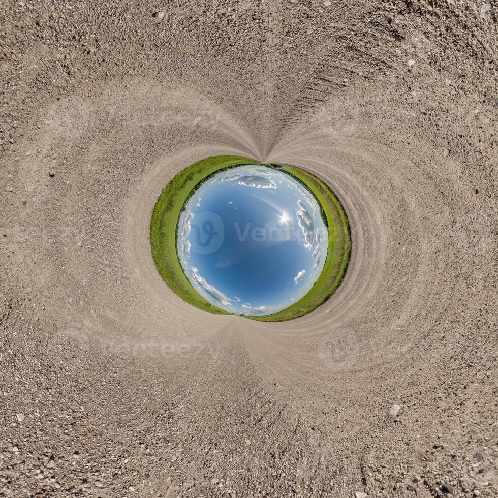 blue hole sphere little planet inside sand or dry grass round frame background photo