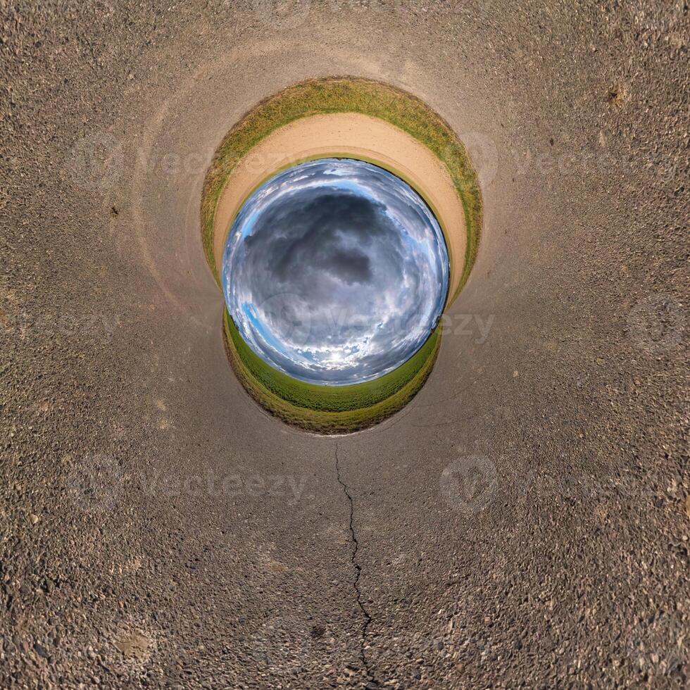 blue hole sphere little planet inside sand or dry grass round frame background photo