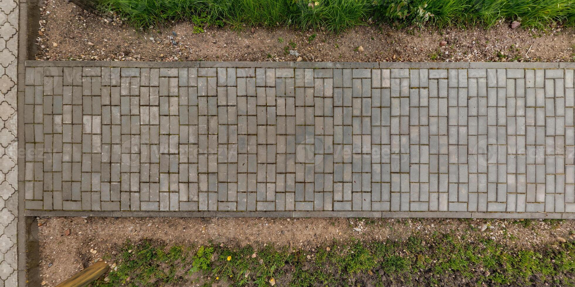 top view of the texture of paving slabs on pedestrian path photo
