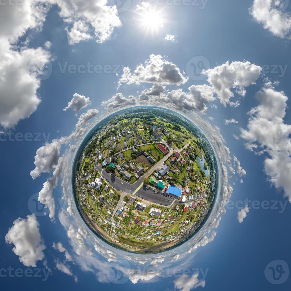 simple tiny planet without buildings in blue sky with beautiful clouds. Transformation of spherical panorama 360 degrees. Spherical abstract aerial view. Curvature of space. photo
