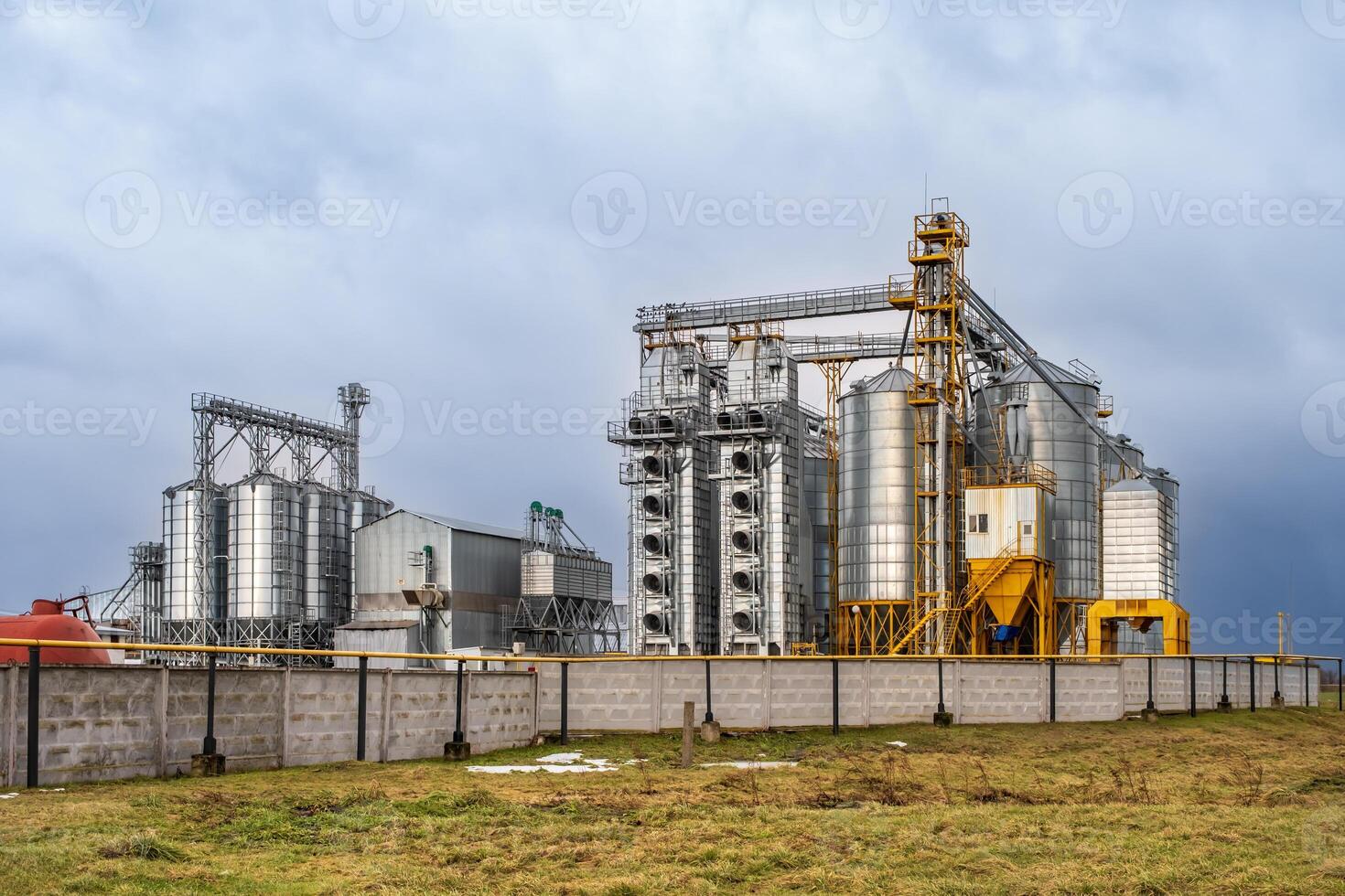 silos on agro-industrial complex with seed cleaning and drying line for grain storage photo