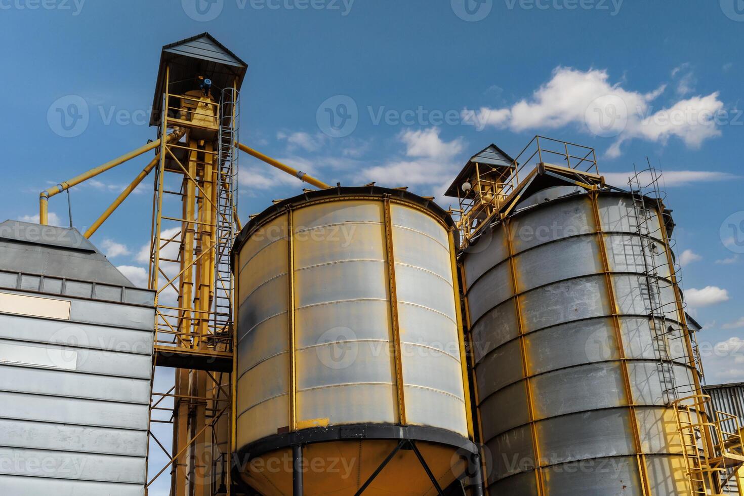 silos granary elevator on agro-industrial complex with seed cleaning and drying line for grain storage photo