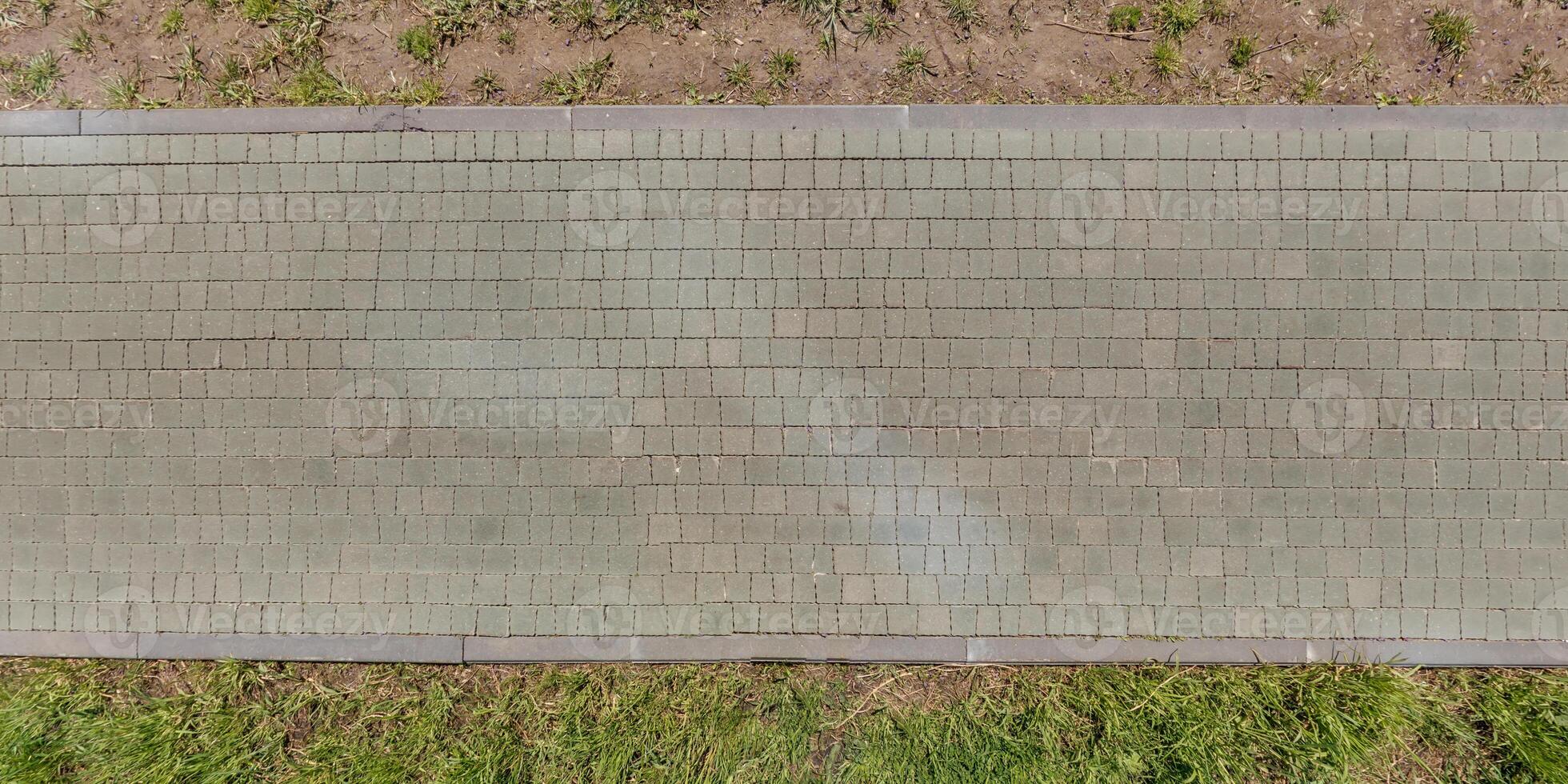 top view of the texture of paving slabs on pedestrian path photo
