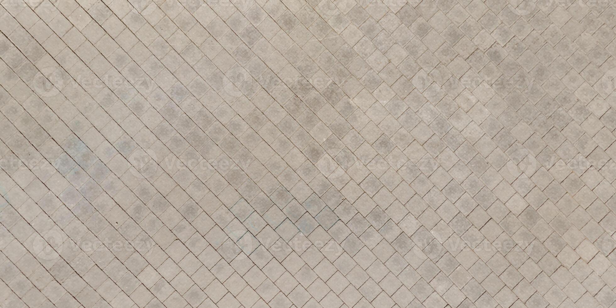 top view of the texture of paving slabs on pedestrian path photo