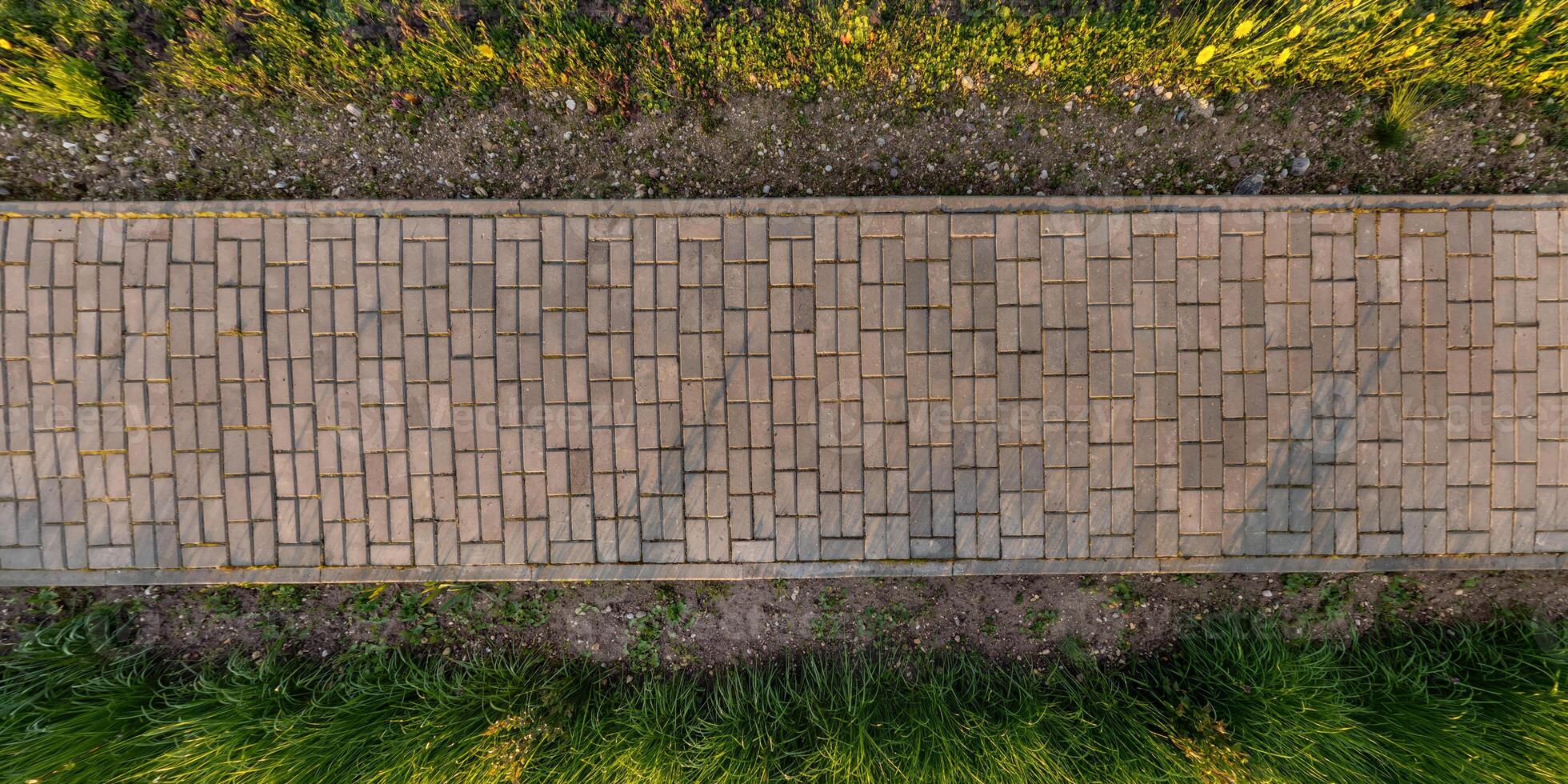 top view of the texture of paving slabs on pedestrian path photo